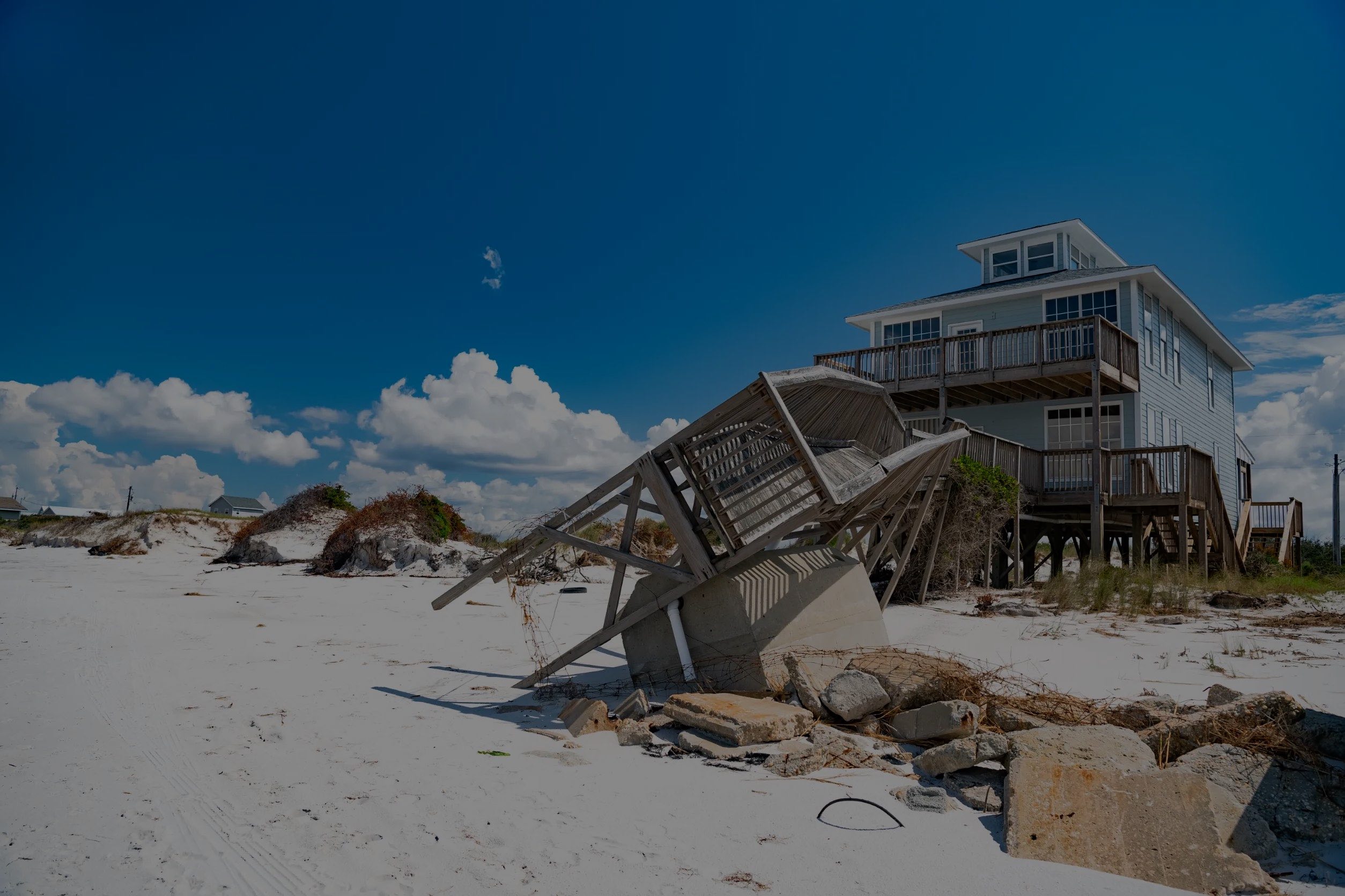 coastal home with damage to walkwway